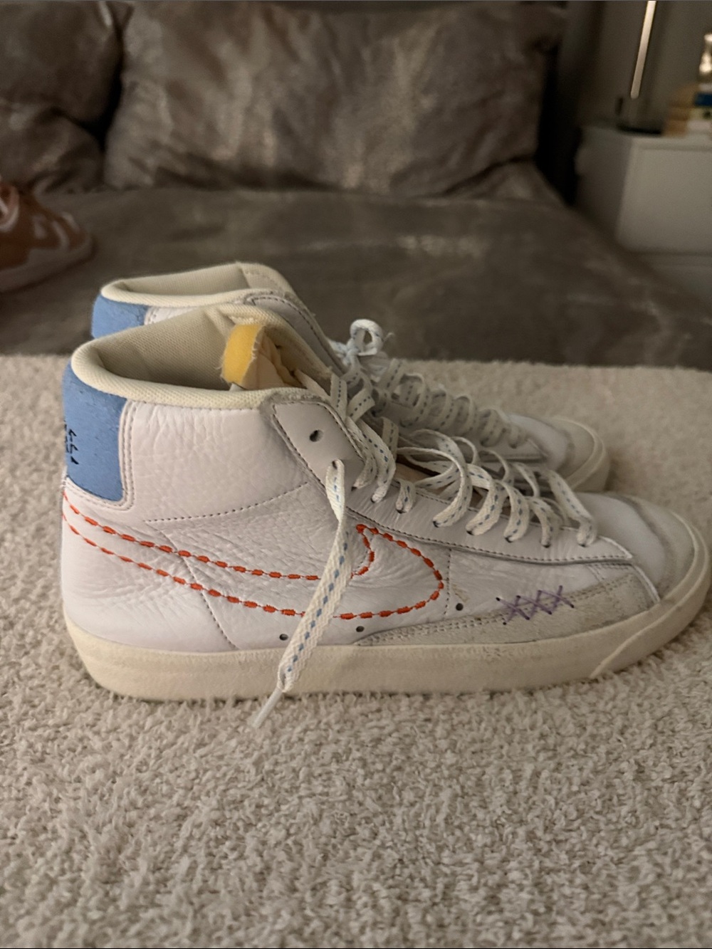 Nike Kids White High-Top Sneakers with Orange Stitching and Blue Heel
